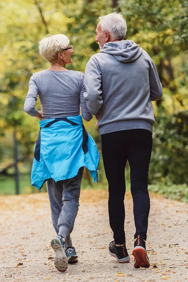 Abdominal-Weight-Loss-Treatment An older couple on a power walk. Get abdominal weight loss treatment from Nonkulie Dladla, M.D. in Manhattan.
