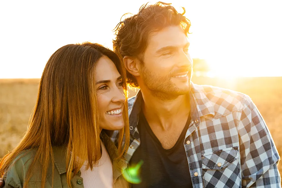 Allergy-Treatment-Clinic A happy middle-aged couple in a field at sunset. Get blood-based allergy testing from Nonkulie Dladla, M.D. in Manhattan.