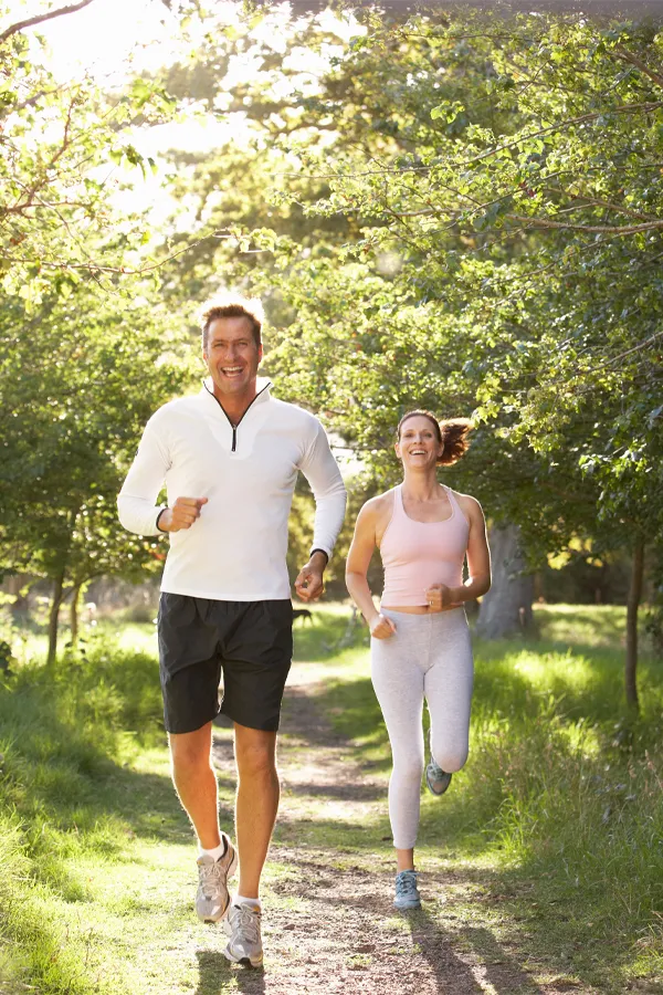 Cellular-Regeneration-Treatment A middle-aged couple on a run. Get stem cell therapy from Nonkulie Dladla, M.D. in Manhattan.