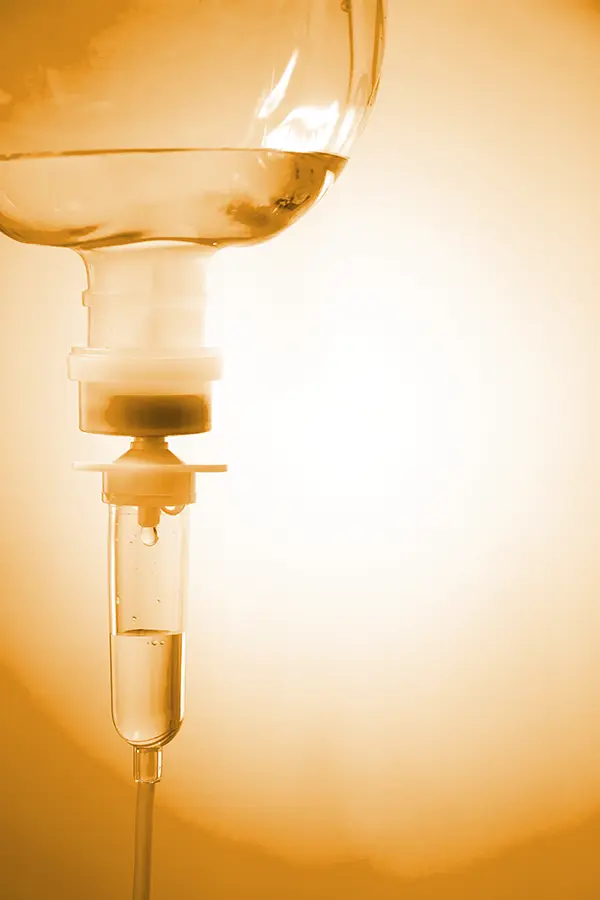 Edetate-Calcium-Disodium-IV-Therapy-Treatment An IV drip in orange hues. Get Edetate Calcium Disodium IV Therapy from Nonkulie Dladla, M.D. in Manhattan.