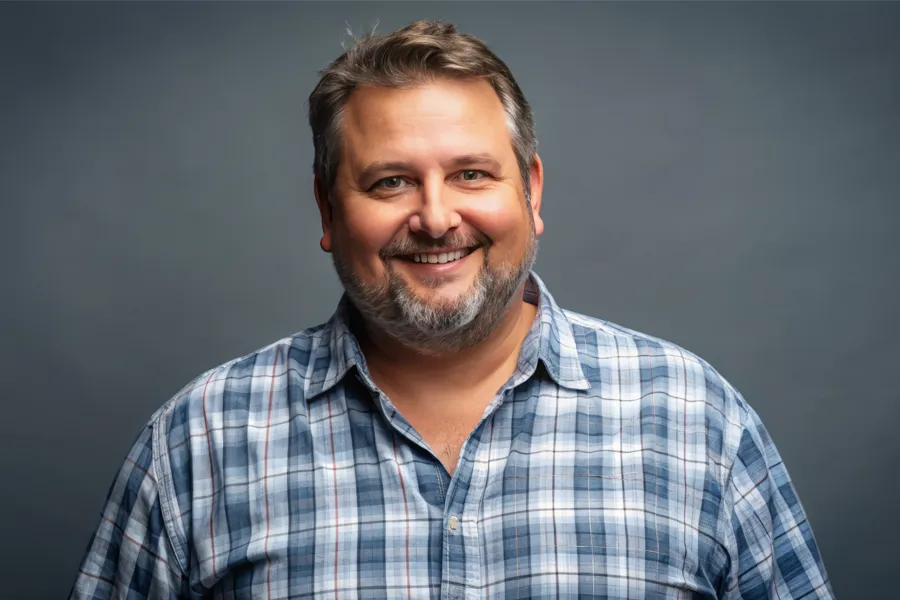 High-Cholesterol-Clinic A happy, slightly overweight man with a beard. Get treatment for high cholesterol from Nonkulie Dladla, M.D. in Manhattan.