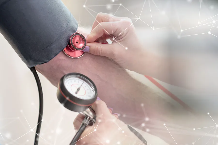 Hypertension-Clinic A man gets his blood pressure taken. Schedule hypertension treatment from Nonkulie Dladla, M.D. in Manhattan.