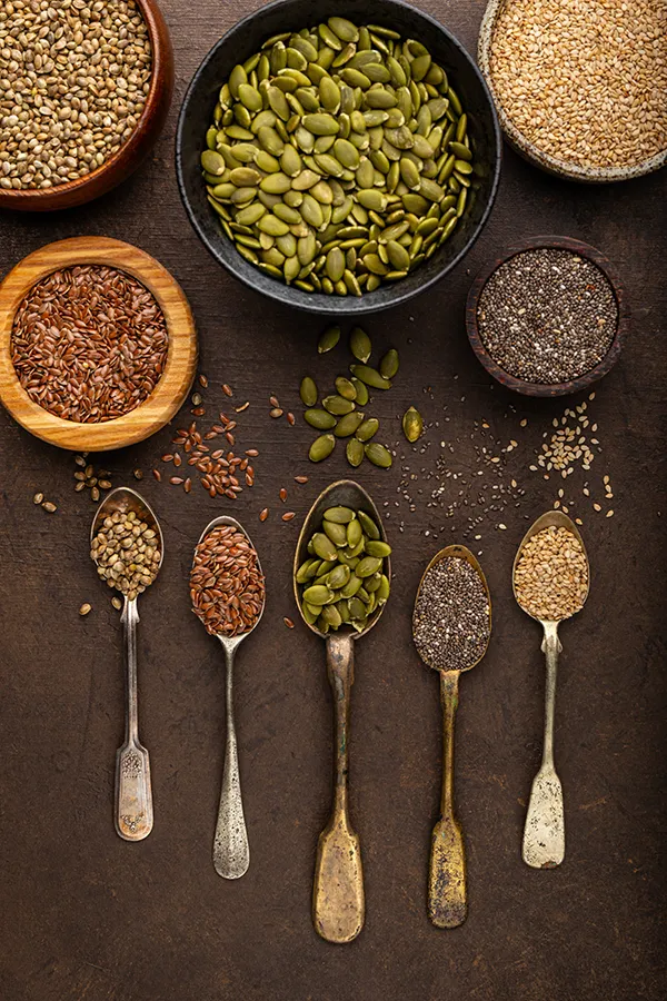 Mineral-IV-Drip-Treatment Mineral-rich seeds in spoons and bowls. Get a Mineral IV Drip from Nonkulie Dladla, M.D. in Manhattan.