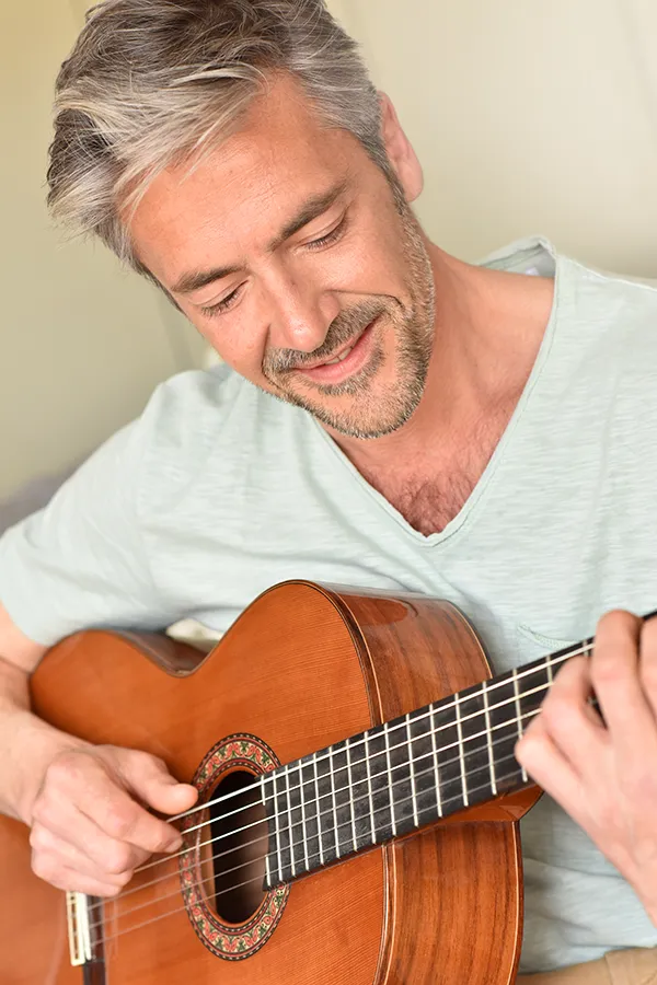 Hormonal-and-Vitality-Peptides-Treatment A middle-aged black man and white woman embrace outside. Get Hormonal and Vitality Peptide Treatment from Nonkulie Dladla, M.D. in Manhattan.