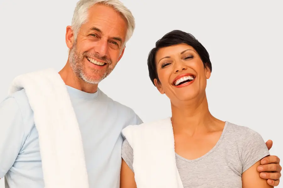PEMF-Therapy-Clinic A mature man and woman with towels draped over their shoulders smiling after a work out. Get PEMF Pulsed Electromagnetic Field therapy from Nonkulie Dladla, M.D. in Manhattan.