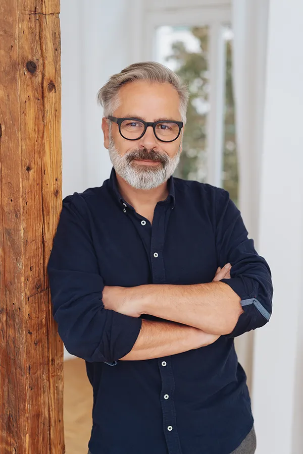 Red-Light-Therapy-for-Hair-Restoration-Treatment A middle-aged man with a full head of hair. Get red light therapy for hair restoration from Nonkulie Dladla, M.D. in Manhattan.