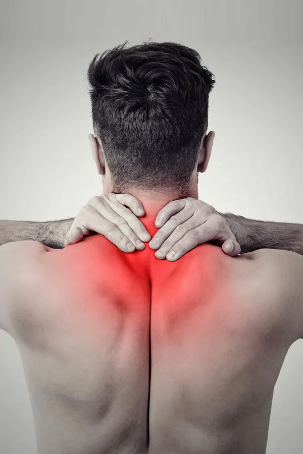 Regenerative-Medicine-for-Back-Pain-Treatment A man holds his upper back in pain. Get Regenerative Medicine for Back Pain from Nonkulie Dladla, M.D. in Manhattan.