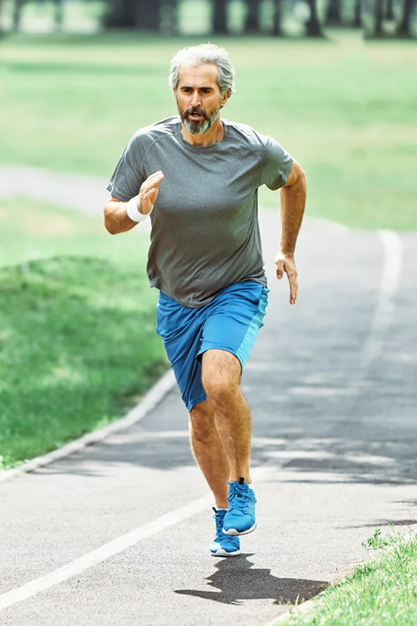 Regenerative-Medicine-for-Injury-Rehabilitation-Treatment A middle-aged man running on a track. Get Regenerative Medicine for Injury Rehabilitation from Nonkulie Dladla, M.D. in Manhattan.
