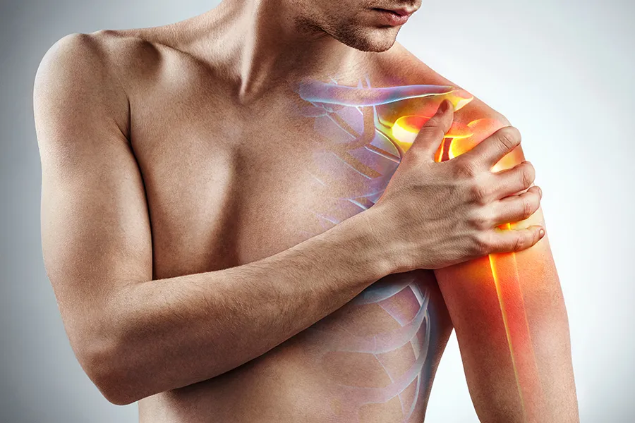 Rotator-Cuff-Clinic A man holds his shoulder; a 3D illustration of the musculo-skeletal shoulder is on the area. Get rotator cuff treatment from Nonkulie Dladla, M.D. in Manhattan.