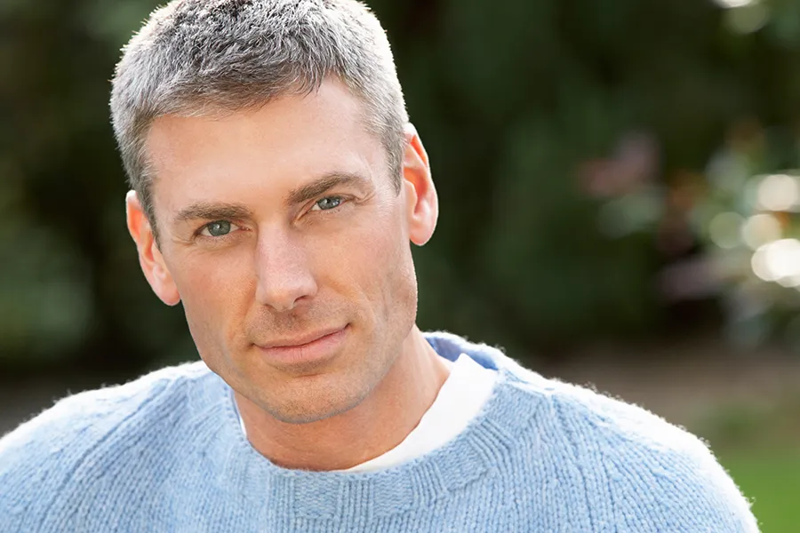 Stem-Cell-Hair-Restoration-Clinic A middle-aged man with short, full salt-and-pepper hair. Get Stem Cell Hair Restoration Therapy from Nonkulie Dladla, M.D. in Manhattan.